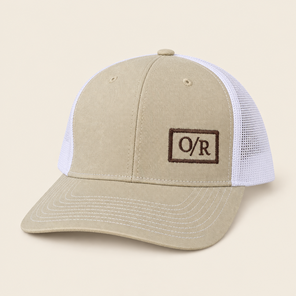 Khaki and white mesh Open Range trucker hat with brown embroidered O/R logo, three-quarter front view