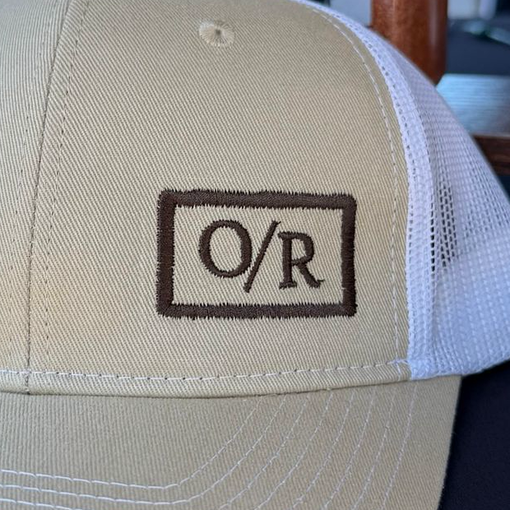 Close-up of the brown O/R embroidery on the khaki front panel