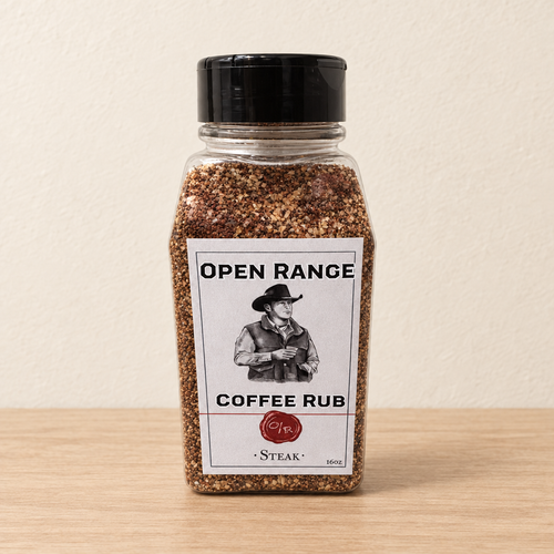 Open Range Coffee Steak Rub jar on a light oak shelf against a cream wall
