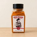 Open Range Taco Seasoning jar on a light oak shelf against a cream wall
