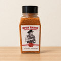 Open Range Creole Seasoning jar on a light oak shelf against a cream wall